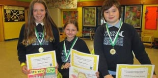 Pupils take part in a drawing competition to promote road safety