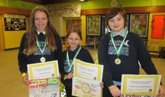 Pupils take part in a drawing competition to promote road safety