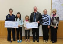 Sisters raise £1,000 on Muddy Mountain challenge