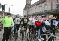 Cyclists arrive in Aber after gruelling charity ride