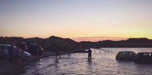 Beachgoers warned after 14 cars submerged by tide