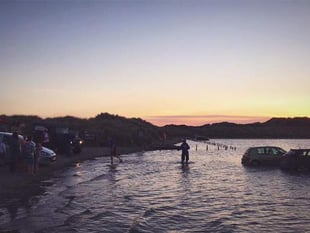 Beachgoers warned after 14 cars submerged by tide