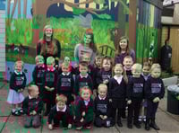 College students' mural adds a splash of colour to school wall