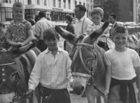 Do you recognise these children enjoying a donkey ride?