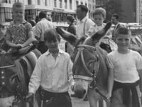 Do you recognise these children enjoying a donkey ride?