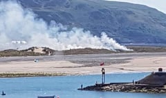 Dunes blackened as fire rages in Fairbourne