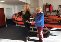 Bride hands wedding donations to RNLI