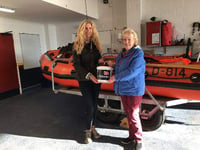 Bride hands wedding donations to RNLI