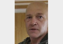 Armed police on streets after potential sighting of suspected murderer
