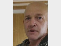 Armed police on streets after potential sighting of suspected murderer