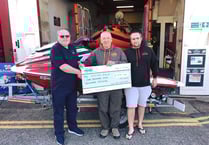 Jet skiers hand out charity cheques