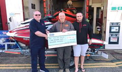 Jet skiers hand out charity cheques