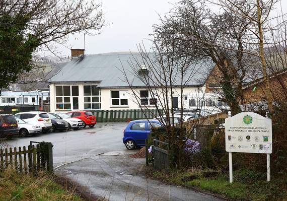 Teaching assistant put her fingers into pupil's mouth