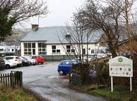 Teaching assistant put her fingers into pupil's mouth