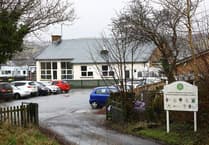 Teaching assistant put her fingers into pupil's mouth