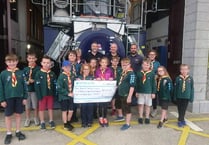 Cubs donate sponsored walk proceeds to lifeboat station