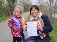 Three-year-old helps tidy up town