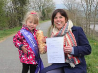 Three-year-old helps tidy up town