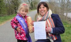 Three-year-old helps tidy up town