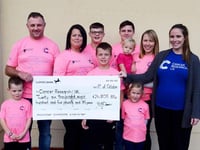 Postman delivers £26,000 to charity
