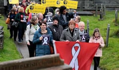 Mach marchers call for end to domestic abuse