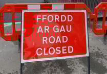 Road closed after school bus collision