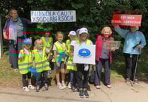 Claps and cheers for 'save our school' march