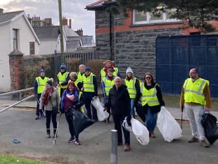 Rotarians roll up their sleeves to clean up town