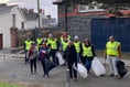 Rotarians roll up their sleeves to clean up town