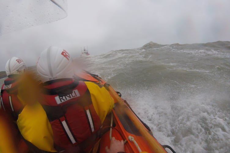 New Quay RNLI’s inshore lifeboat returning to station following the all-weather lifeboat through Storm Dudley