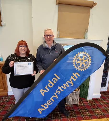 President Kerry Ferguson and executive secretary Richard Griffiths celebrated the news at their first Ardal Aberystwyth Rotary Club meeting as a recognised Rotary Club
