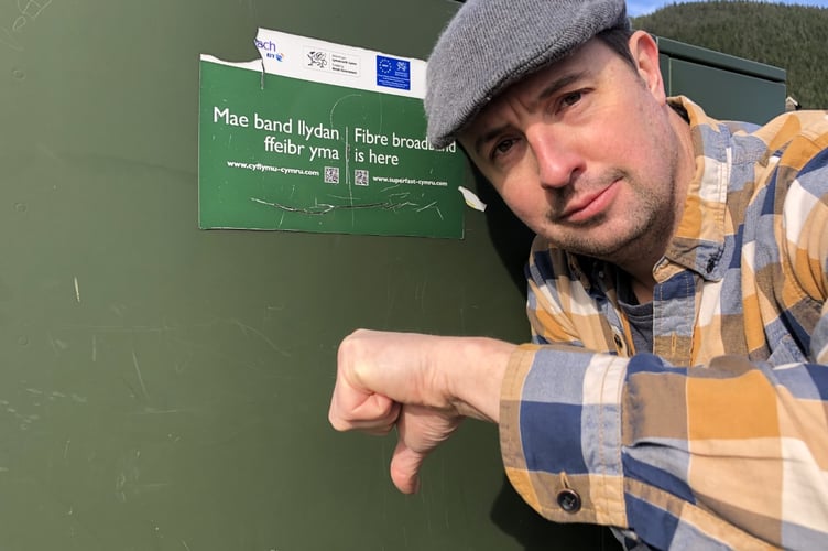 David Evans next to the fibre unit