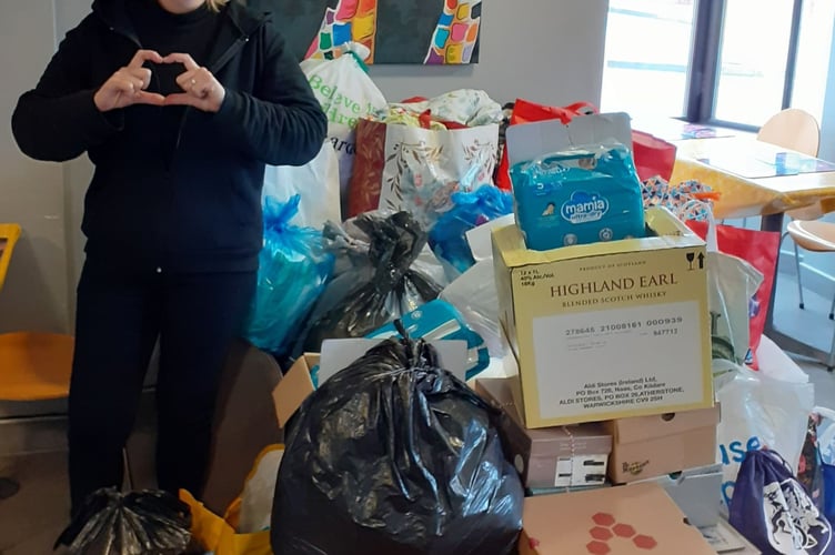 Jill from Finch Square Cafe with the donation for Ukrainian refugees, to be taken to Poland 