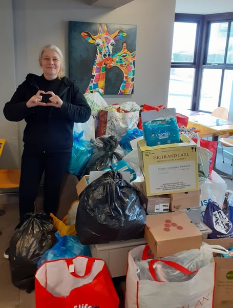 Jill from Finch Square Cafe with the donation for Ukrainian refugees, to be taken to Poland