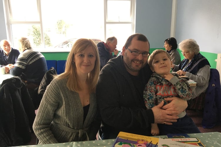 Andrew and Angela Beard with Johnnie at Borth Community Hub during all-day breakfast for Ukrainian