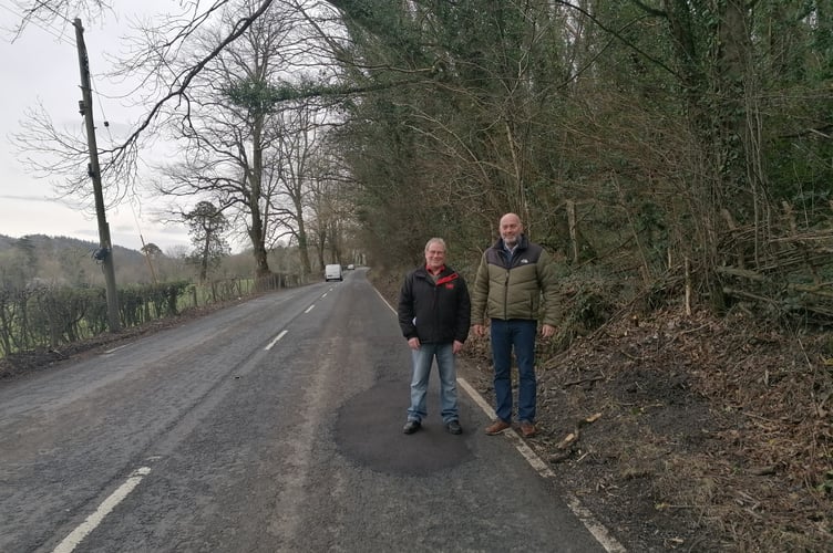 Councillr Meirion Davies and prospective Councillor Geraint Hughes standing on the A485