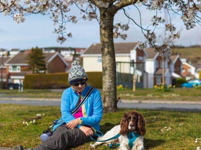 Waunfawr resident sitting by tree