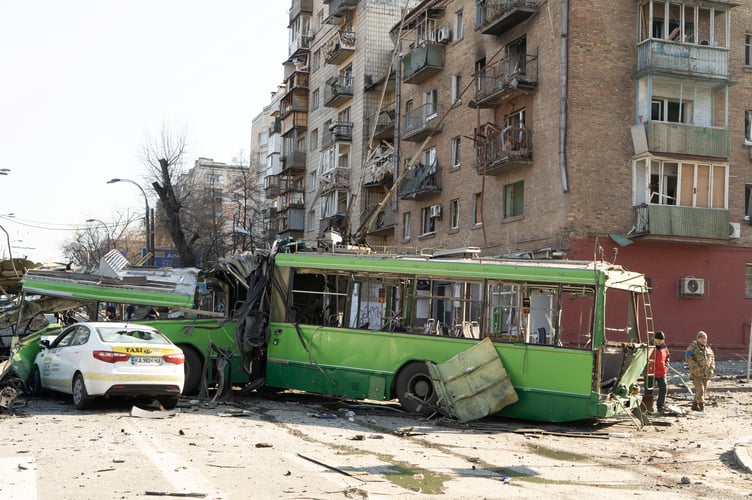 This picture: A destroyed trolley bus, hit by pieces of a Russian missile intercepted by Ukrainian air defenses over Kyiv. As the trolley was being used as a stationary barricade to impede enemy troop movements, it was mercifully empty. However, one bystander was nonetheless killed.

See SWNS story SWBRkyiv.

Photojournalist Bennett Murray captured scenes on March 14 in Obolon district, Kyiv, Ukraine.