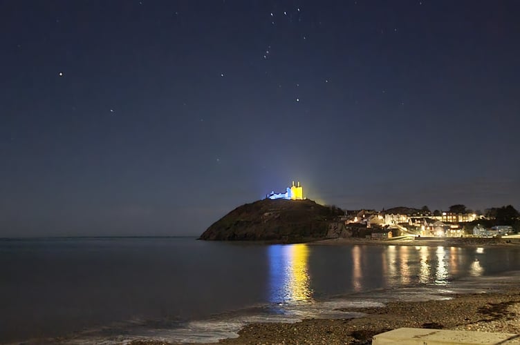Criccieth Castle lit up in the colours of the Ukrainian flag