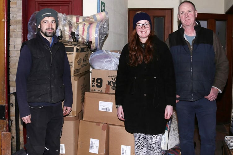 Chris Evans, Jemma Hennighan and Dai Hennighan bring donations from Machynlleth