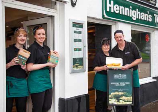 The Hennighan family outside their chip shop which has been in Machynlleth for 40 years
