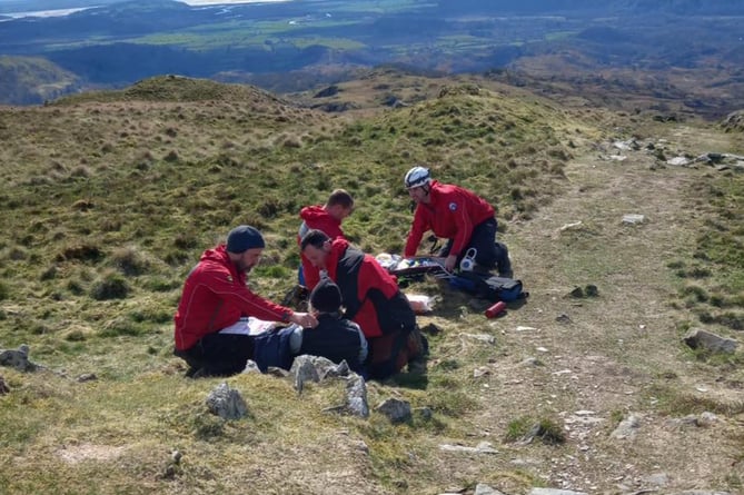The team helped the woman who had fallen, suffering an arm injury
