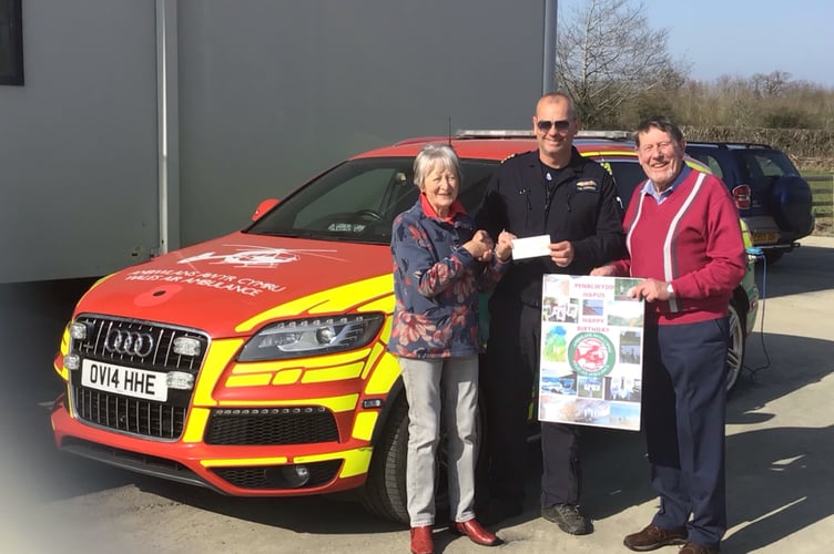 Margaret Worrall presented cheque for £1000 raised from the sale of her Art work