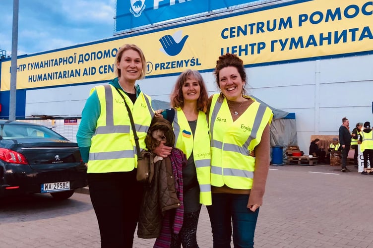 Sara Wheeler, right, volunteered for a week in Poland at the border with Ukraine