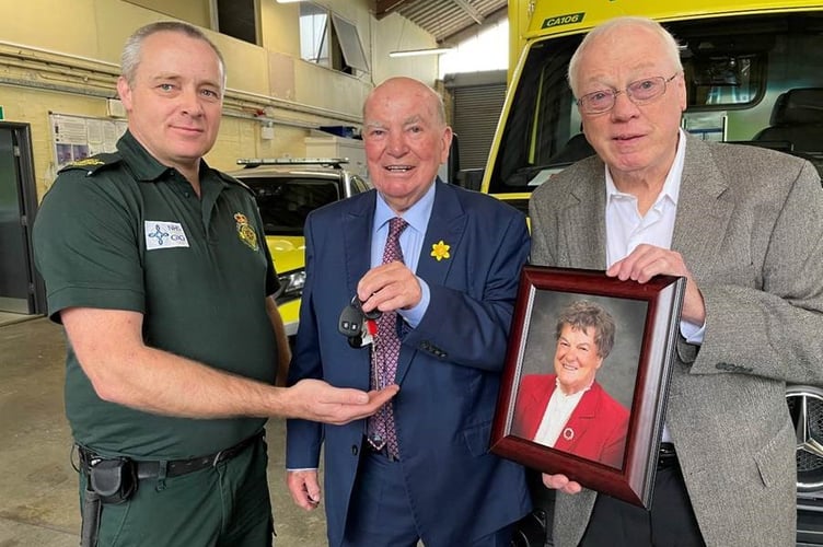 Hefin Jones hands over the keys to Paramedic John Cleaton