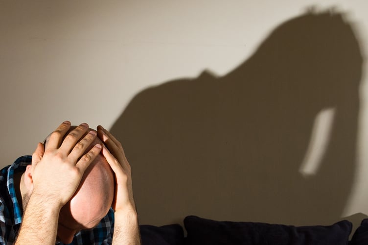 PICTURE POSED BY MODEL A man showing signs of depression.