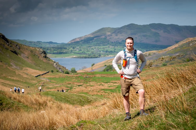 © Harry Atkinson 08/05/2022. Lewis Jevons climbs all the Wainwright Fells using only public transport to get to each location. Pictures from his journey via bus to his final fell, Rannerdale Knotts, from Keswick. // Lewis climbing Rannerdale Knotts..