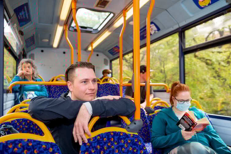 © Harry Atkinson 08/05/2022. Lewis Jevons climbs all the Wainwright Fells using only public transport to get to each location. Pictures from his journey via bus to his final fell, Rannerdale Knotts, from Keswick. // Lewis on the bus from Keswick to Buttermere.