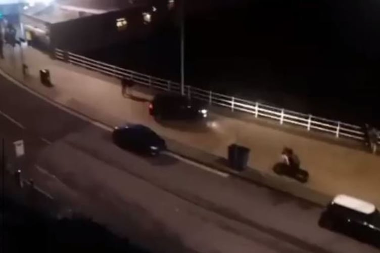 Three men have been handed suspended prison sentences after a car was driven at pedestrians on Aberystwyth promenade