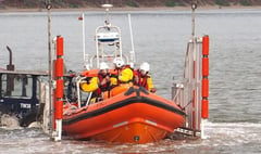 Lifeboat rescues woman with broken arm on remote beach